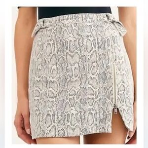 Free People snake skin mini skirt with adjustable sides.